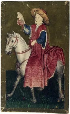 A painted playing card of a king in a red cloak on a white horse, a falcon on his raised hand